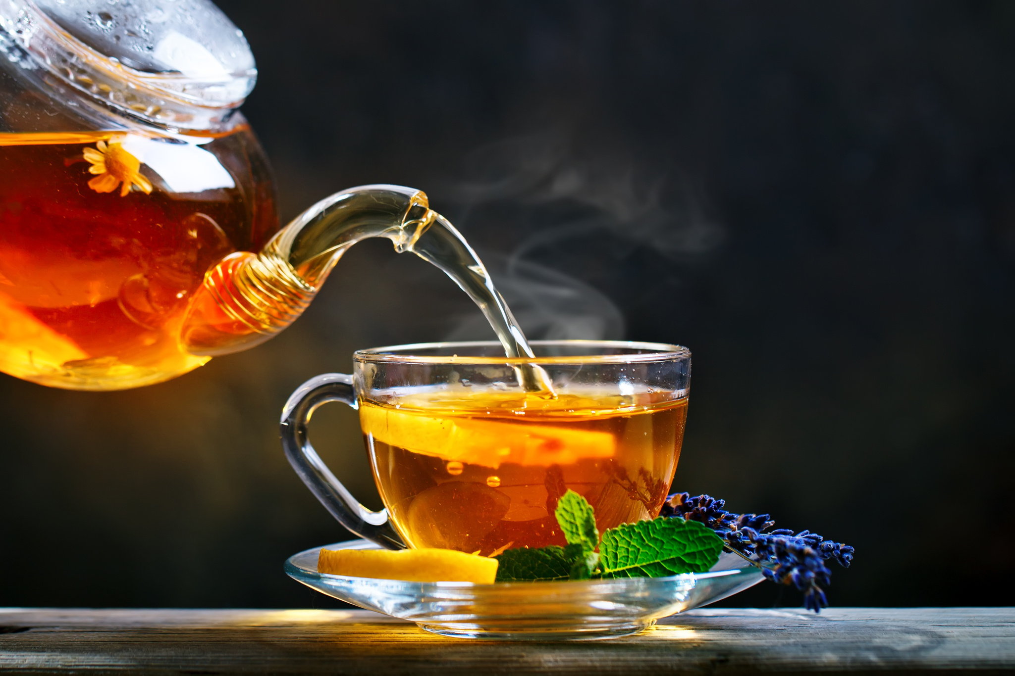 Process brewing tea,tea ceremony. Cup of freshly brewed black tea,warm soft light